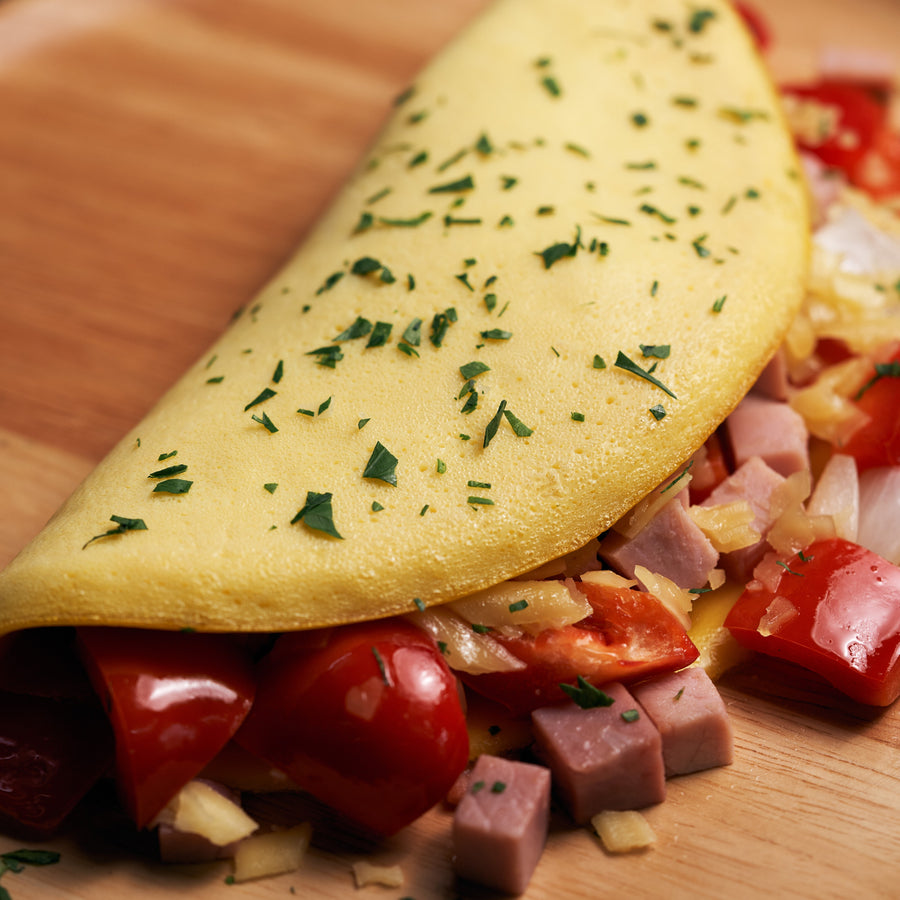 Classic American Omelette with Onions, Sweet Peppers, Smoked Ham & Cheese