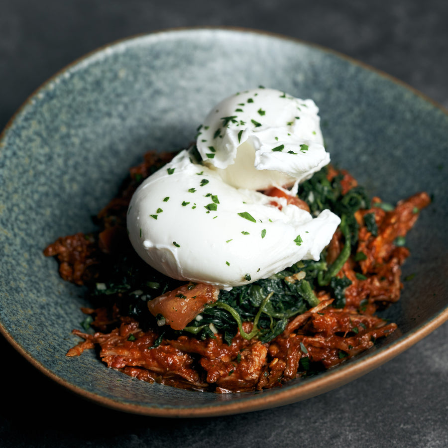 Poached Eggs with Pulled Pork El Pastor and Sautéed Spinach & Tomatoes