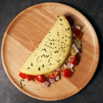 Classic American Omelette with Onions, Sweet Peppers, Smoked Ham & Cheese
