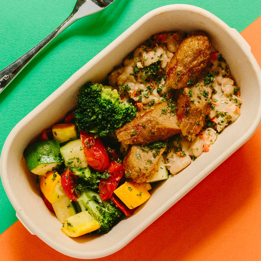 White Bean Cassoulet with Roasted Broccoli, Zucchini and Plant Based Brat Sausage