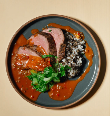 Roasted Cajun Beef Fillet with Mustard Greens & Creole Sauce