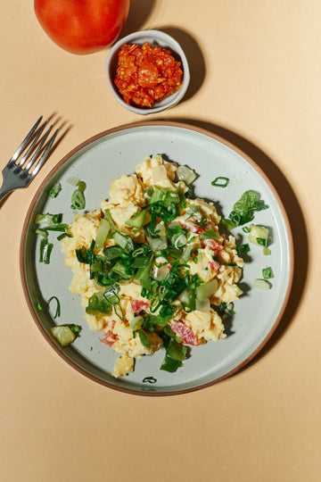 Farmer's Market Scrambled Eggs with Roasted Spring Vegetables, Cheddar Cheese, Tomato Chutney