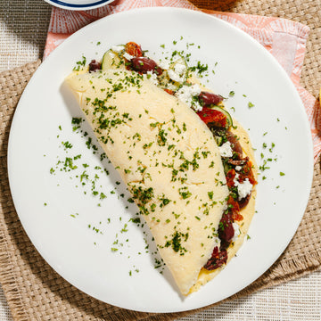 Greek Omelette with Tomatoes, Kalamata Olives, Zucchini, Red Peppers, Onion & Feta
