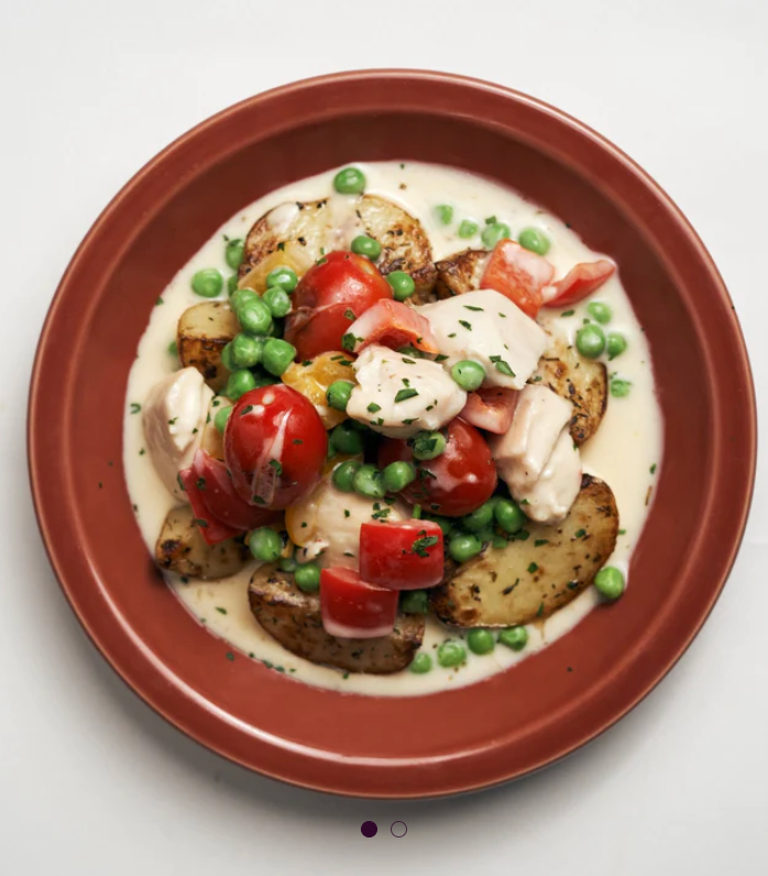Plant Based Chicken Mornay with Assorted Bell Peppers, Green Peas, Cherry Tomatoes & Roasted Potatoes