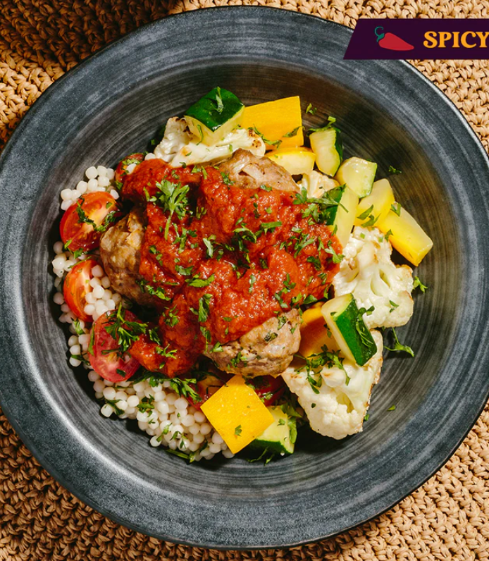 Plant Based Meatball with Spicy Low Fat Tomato Sauce, Harissa Cauliflower, Zucchini & Cous Cous
