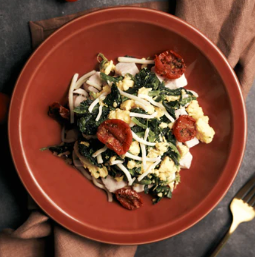 High Protein Scrambled Eggs Florentine with Plant-Based Chicken, Creamed Spinach & Oven Dried Cherry Tomato
