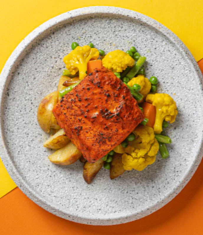 Tandoori Marinated Plant-Based Fish with Market Vegetables, Turmeric Cauliflower, Tomato Cucumber Raita & Vegetable Biryani