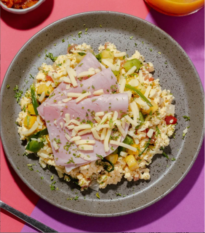 Farmers' Market Scrambled Eggs with Lean Ham, Roasted Spring Vegetables, Cheddar Cheese & Tomato Chutney