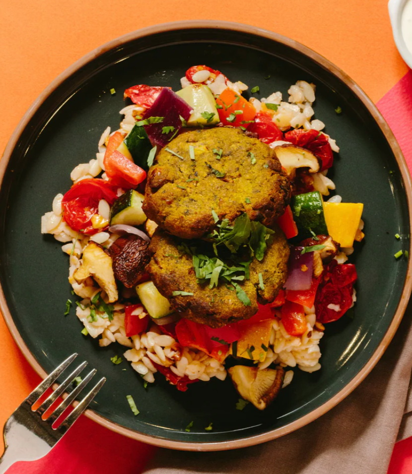 Chickpea & Spinach Fritters with Roasted Vegetables, Whipped Feta, Sundried Tomatoes & Lemon Orzo